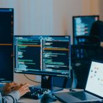 Group Adult Asia male, female freelance typing write prompt AI bot IT app smart program nomad, video game, terminal with coding language, designer, big data center on computer in night office.